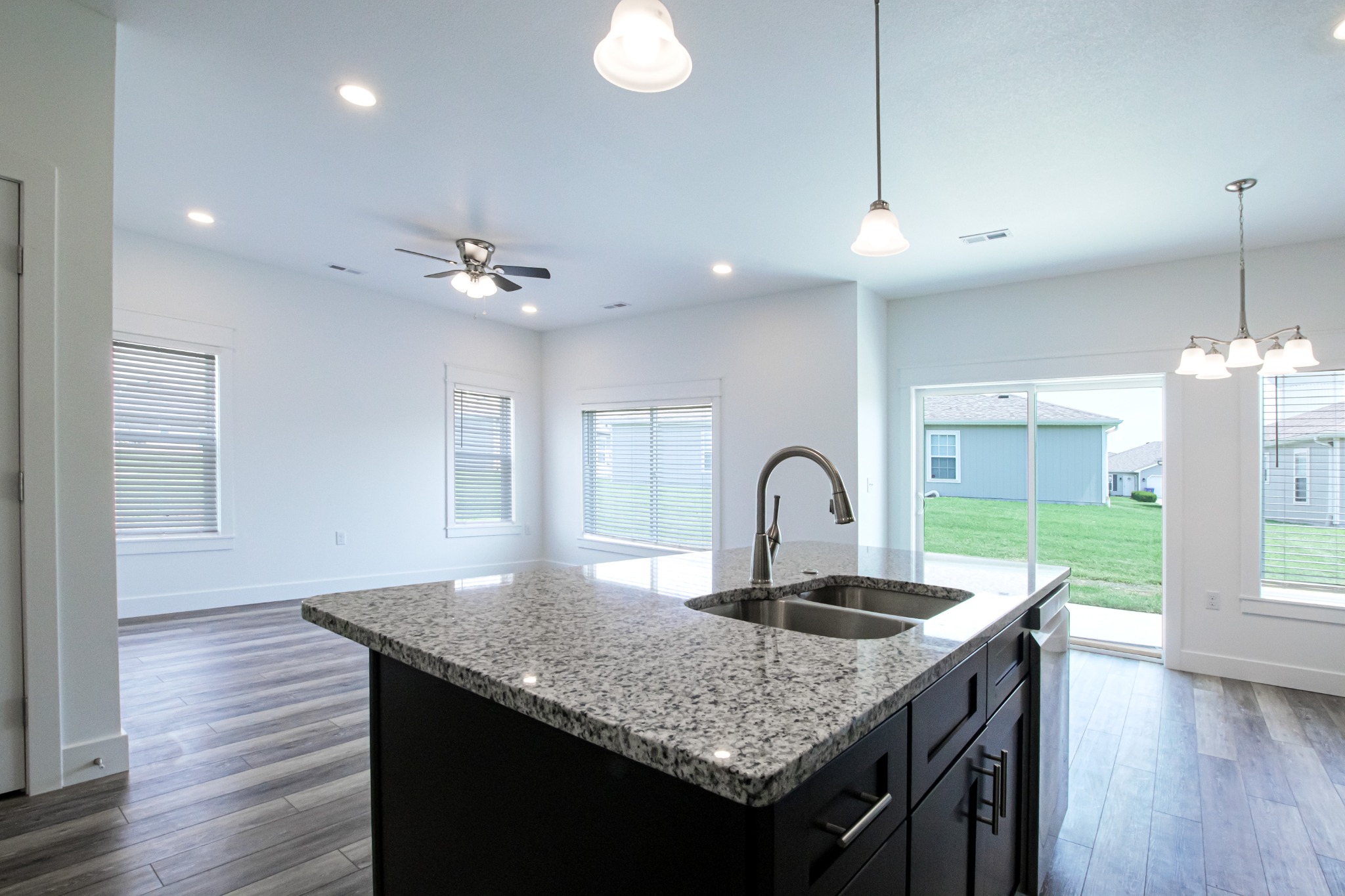 Open-concept kitchen and living area by SAAK Builders in Central Missouri